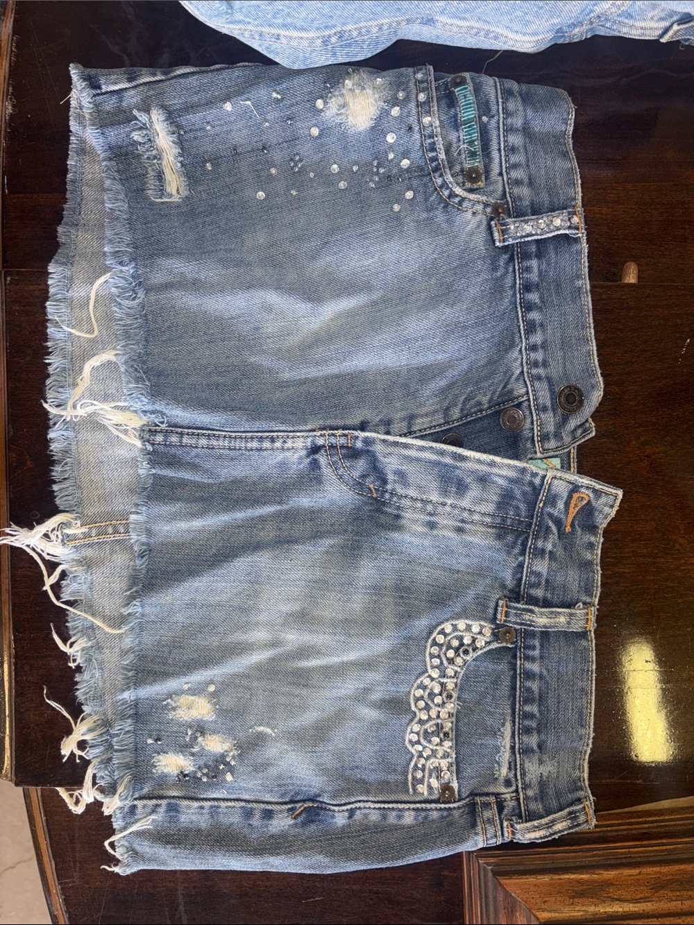 Women's Distressed Blue Denim Mini Skirt with Rhinestone Detail